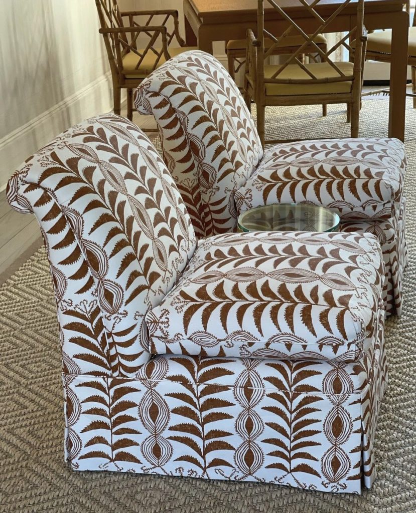 neutral patterned slipper chair in living room